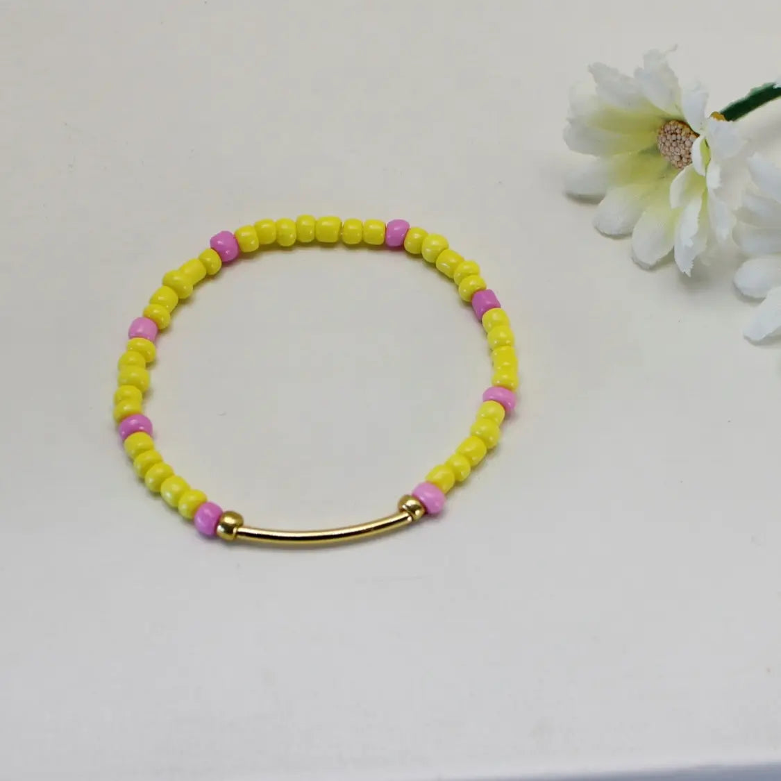 Rosa og gul enkelt armbånd