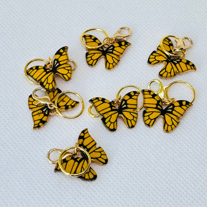 Sommerfugl maskemarkører i gullnyanser