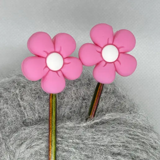 Maskestopper med silikonblomst i rosa, på pinnene