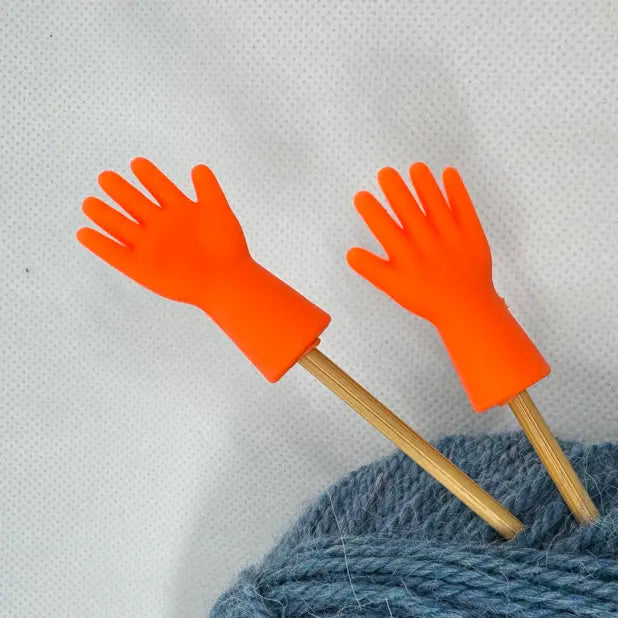 Maskestoppere Vink i orange på strikkepinner