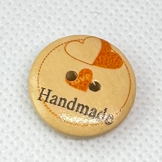 Treknapp med orange hjerte og tekst